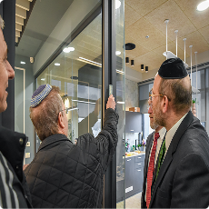 Spigler Affixing the Mezuza in the new conference room